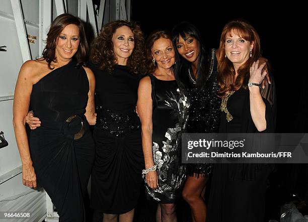 Designers Donna Karan, Marisa Berenson, designer Diane Von Furstenberg, model Naomi Campbell, and Sarah Ferguson, the duchess of York pose backstage...