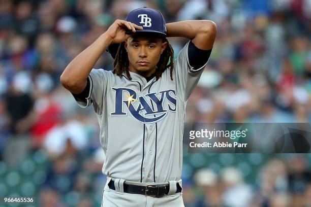 Chris Archer of the Tampa Bay Rays reacts after giving up an RBI single to Nelson Cruz in the third inning to score Jean Segura of the Seattle...