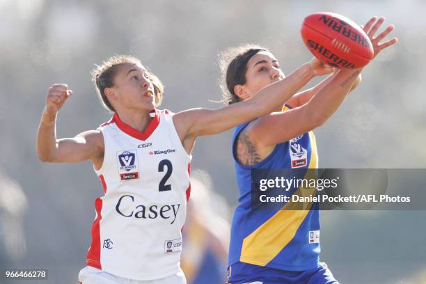 Emily Paterno of Williamstown and Aliesha Newman of the Scorpions contest the ball during the round five VFL match between Williamstown and Casey at...