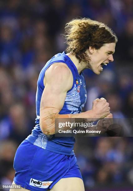 Ben Brown of the Kangaroos celebrates kicking a goal during the round 11 AFL match between the North Melbourne Kangaroos and the Brisbane Lions at...