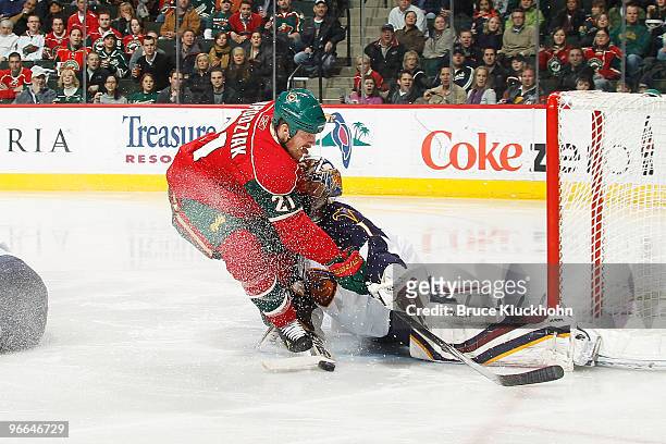 Kyle Brodziak of the Minnesota Wild attempts to score but is stopped by goalie Johan Hedberg of the Atlanta Thrashers during the game at the Xcel...