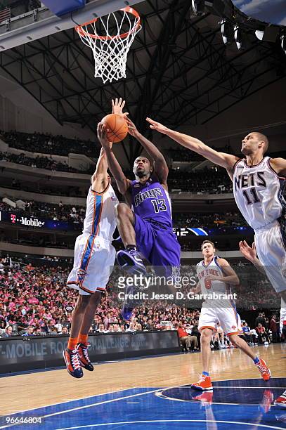 Tyreke Evans of the Rookie team shoots against Brook Lopez of the Sophomore Team during 2009 T-Mobile Rookie Challenge and Youth Jam on February 12,...