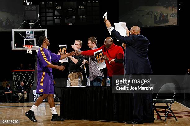Dar Tucker of the Los Angeles D-Fenders is congratulated by the judges for his dunk during the Slam Dunk Contest as part of the NBA D-League Dream...