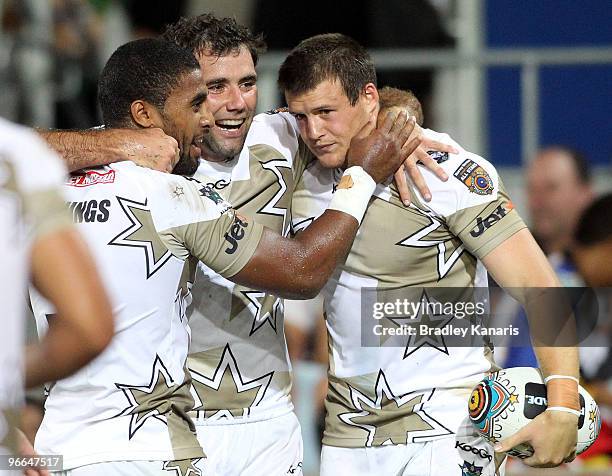 Josh Morris of the NRL All Stars team celebrates with team mates after scoring a try during the Indigenous All and the NRL All Stars match at Skilled...