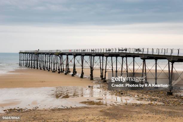 traditional seaside pier at saltburn-by-the-sea, north yorkshire, england - saltburn by the sea fotografías e imágenes de stock