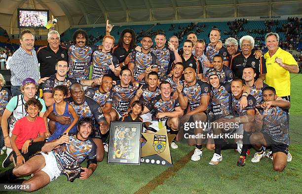 Indigenous All Stars team poses with the trophy after wnning the Indigenous All Stars and the NRL All Stars match at Skilled Park on February 13,...