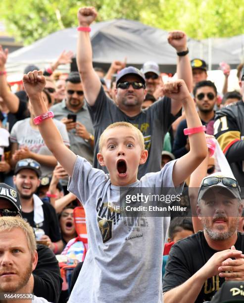 Vegas Golden Knights fan Andrew Kennedy of Nevada, cheers as players are introduced during a Golden Knights road game watch party for Game Three of...