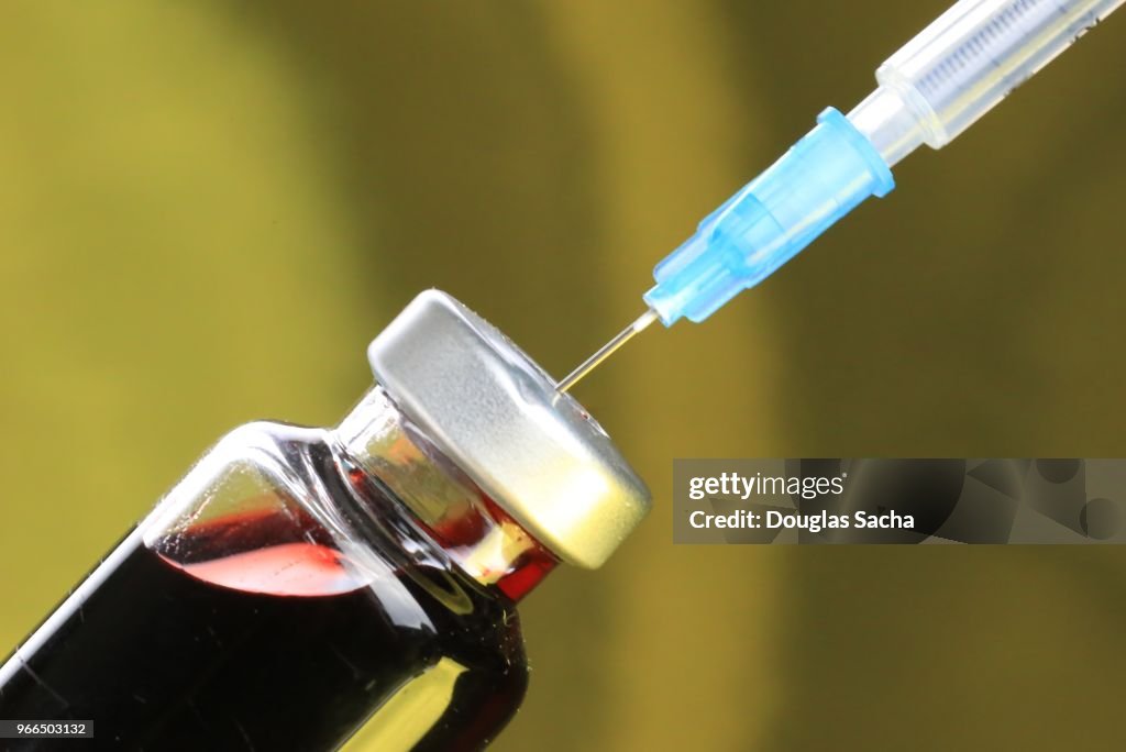 Illegal drug filled disposable syringe -syringe hyperdermic needle - Antibodies immunity in a vaccine - health medical