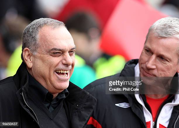 Alan Pardew Manager of Southampton on the right talks with Avram Grant Manager of Portsmouth before the FA Cup sponsored by E.ON fifth round match...
