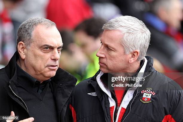 Alan Pardew Manager of Southampton on the right talks with Avram Grant Manager of Portsmouth before the FA Cup sponsored by E.ON fifth round match...