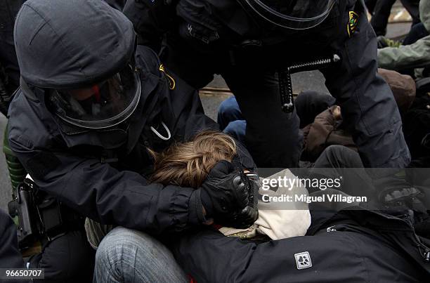 German riot police men remove a blockade of left-wing counter demonstrators on February 13, 2010 in Dresden, Germany. Right-wing Neo-Nazis and their...