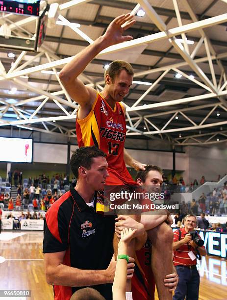 Retiring Tigers great Chris Anstey is carried from the court after the round 20 NBL match between the Melbourne Tigers and the Gold Coast Blaze at...