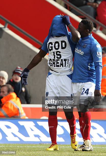 Quincy Owusu-Abeyie of Portsmouth celabrates with Aruna Dindane during the FA Cup sponsored by E.ON fifth round match between Southampton and...