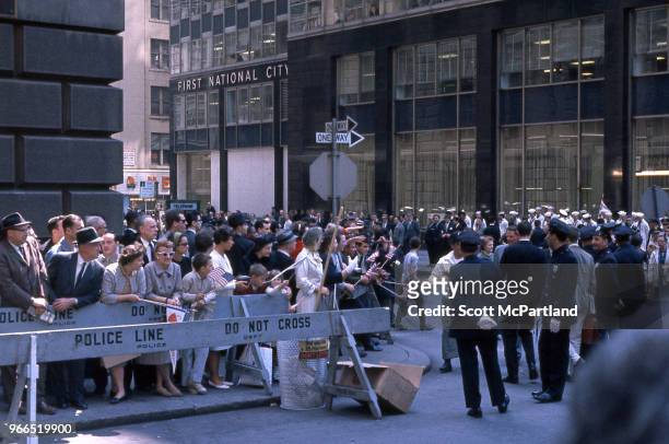 New York City - NYPD Police officers patrol the large crowds along Broadway's 'Canyon Of Heroes,' during a ticker tape parade. The parade was held in...