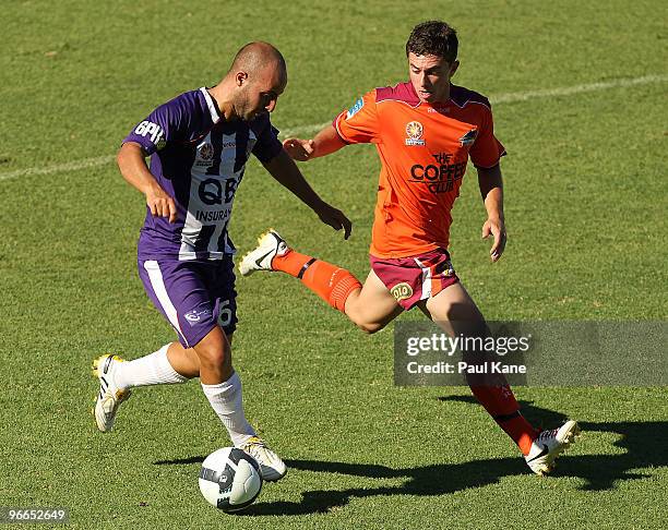 Adriano Pellegrino of the Glory and Tommy Oar of the Roar contest the ball during the round 27 A-League match between Perth Glory and Brisbane Roar...