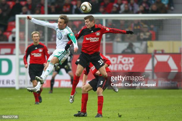 Sebastian Schindzielorz of Wolfsburg and Toni Kroos of Leverkusen go up for a header during the Bundesliga match between Bayer Leverkusen and VfL...