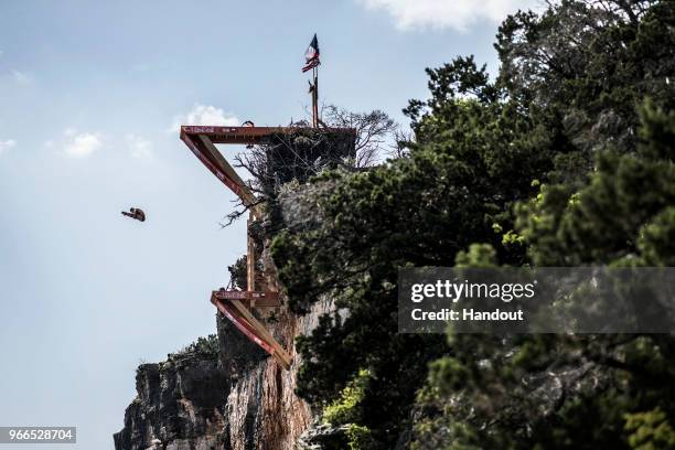 In this handout image provided by Red Bull, Kris Kolanus of Poland dives from the 27 metre platform during the final competition day of the first...