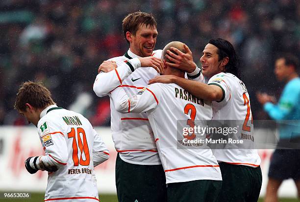 Petri Pasanen of Bremen celebrate with his team mates after he scores his team's 3rd goal during the Bundesliga match between Hannover 96 and SV...