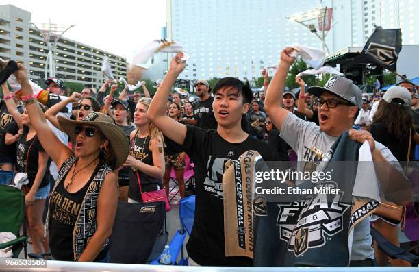 Vegas Golden Knights fans Dion Glenn, Ryen Sugimoto and Rich Sugimoto, all of Nevada, react after Tomas Nosek of the Golden Knights scored a...