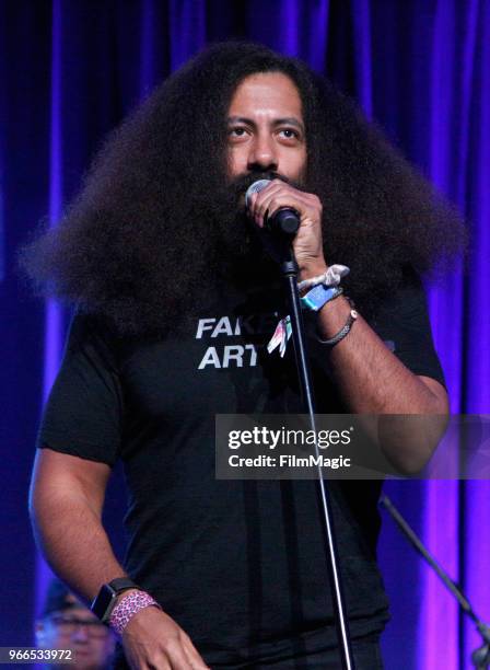 Reggie Watts performs onstage during 'All Bag And A Bag of Chips: 90's Dance Party' in the Larkin Comedy Club during Clusterfest at Civic Center...