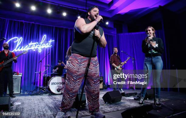 Jon Grabus and Lauren Lapkus perform onstage during 'All Bag And A Bag of Chips: 90's Dance Party' in the Larkin Comedy Club during Clusterfest at...