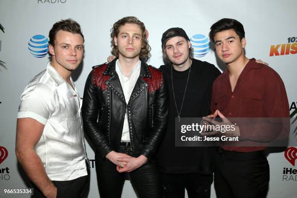 Ashton Irwin, Luke Hemmings, Michael Clifford and Calum Hood of 5 Seconds of Summer backstage at the 2018 iHeartRadio Wango Tango by AT&T at Banc of...