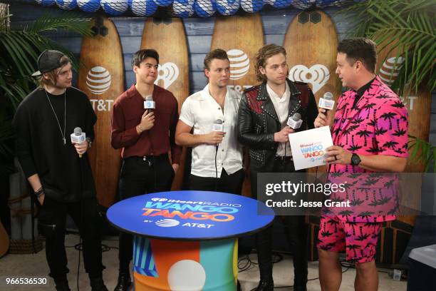 Michael Clifford, Calum Hood, Ashton Irwin, Luke Hemmings of the band 5 Seconds of Summer and Jesse Lozano backstage at the 2018 iHeartRadio Wango...