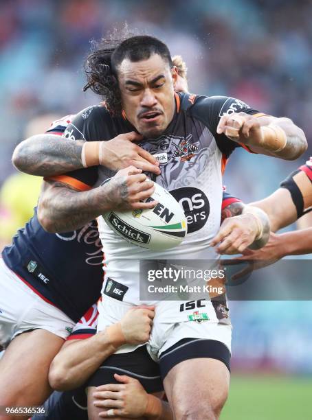 Mahe Fonua of the Tigers is tackled during the round 13 NRL match between the Sydney Roosters and the Wests Tigers at Allianz Stadium on June 3, 2018...