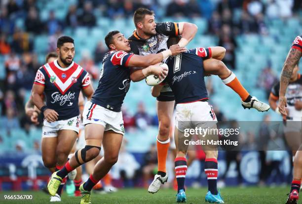 Tim Grant of the Tigers is tackled during the round 13 NRL match between the Sydney Roosters and the Wests Tigers at Allianz Stadium on June 3, 2018...
