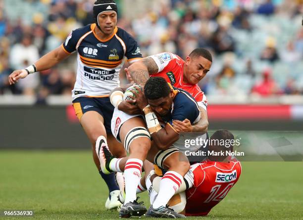 Isi Naisarani of the Brumbies is tackled during the round 16 Super Rugby match between the Brumbies and the Sunwolves at GIO Stadium Stadium on June...