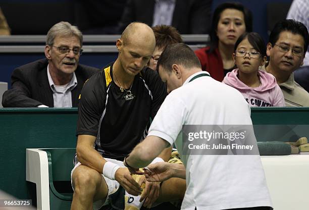 Nikolay Davydenko of Russia receives treatment in his match against Robin Soderling of Sweden during day six of the ABN AMBRO World Tennis Tournament...