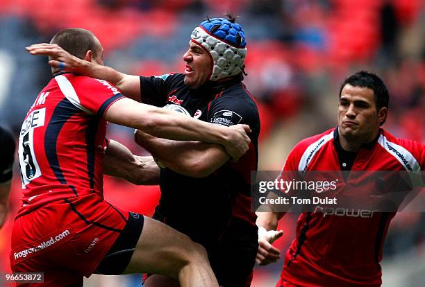 Schalk Brits of Saracens is tackled by Chris Latham of Worcester Warriors during the Guinness Premiership match between Saracens and Worcester...