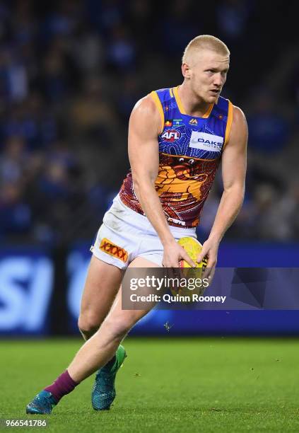 Nick Robertson of the Lions kicks during the round 11 AFL match between the North Melbourne Kangaroos and the Brisbane Lions at Etihad Stadium on...