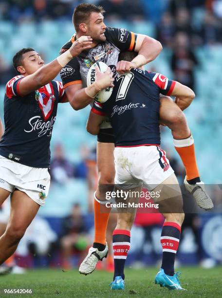 Tim Grant of the Tigers is tackled during the round 13 NRL match between the Sydney Roosters and the Wests Tigers at Allianz Stadium on June 3, 2018...