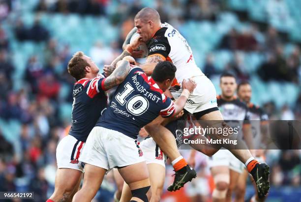 Russell Packer of the Tigers is tackled during the round 13 NRL match between the Sydney Roosters and the Wests Tigers at Allianz Stadium on June 3,...