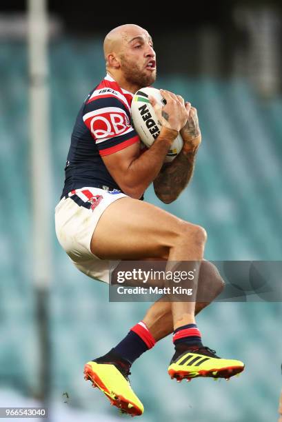 Blake Ferguson of the Roosters takes a high ball during the round 13 NRL match between the Sydney Roosters and the Wests Tigers at Allianz Stadium on...