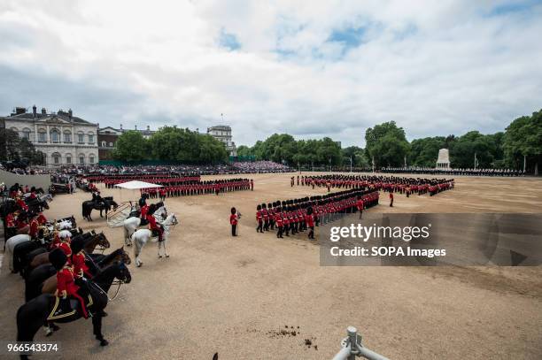 Members of the Royal Guard and horses are seen during the Colonel's Review. Soldiers rehearse their steps as they prepare for Trooping the Color to...