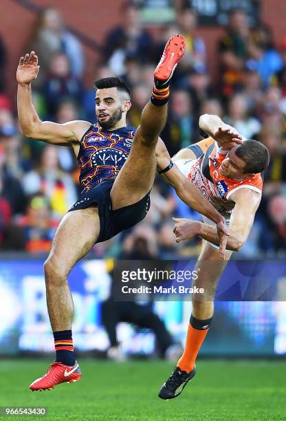 Wayne Milera of the Adelaide Crows collides heavily with Heath Shaw of the Giants during the round 11 AFL match between the Adelaide Crows and the...