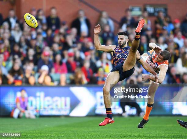 Wayne Milera of the Adelaide Crows collides heavily with Heath Shaw of the Giants during the round 11 AFL match between the Adelaide Crows and the...