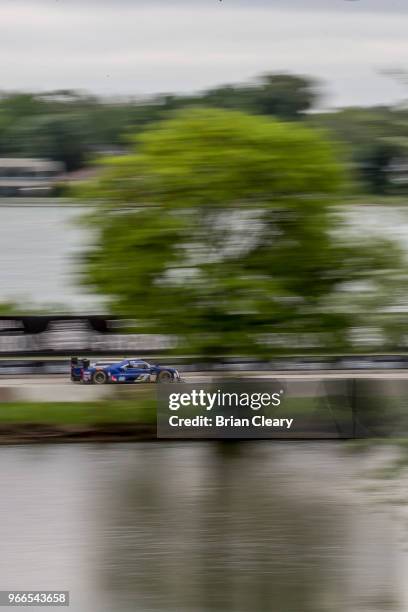 The Cadillac DPi of Tristan Vautier, of France, and Matt McMurray races on the track during the IMSA WeatherTech Series race at the Chevrolet Detroit...