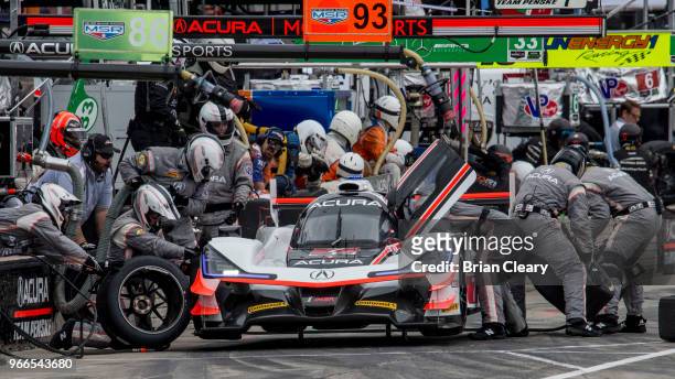 The Acura DPi of Ricky Taylor and Helio Castroneves, of Brazil, rmakes a pit stop during the IMSA WeatherTech Series race at the Chevrolet Detroit...