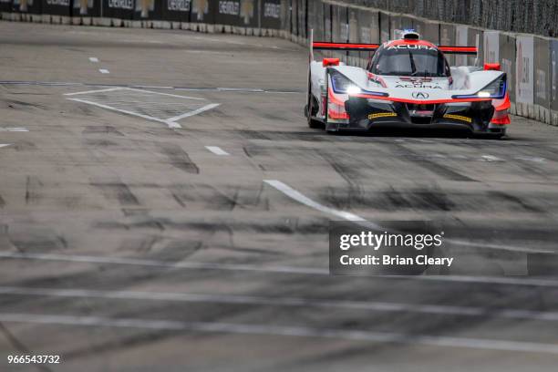 The Acura DPi of Dane Cameron and Juan Pablo Montoya, of Colombia, , races on the track during the IMSA WeatherTech Series race at the Chevrolet...