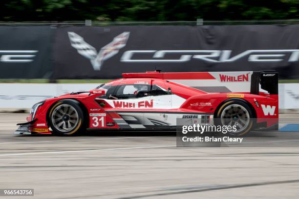 The Cadillac DPi of Eric Curran, L, and Felipe Albuquerque, of Poetugal, races to victory during the IMSA WeatherTech Series race at the Chevrolet...