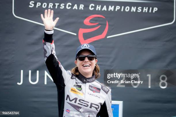 Katherine Legge, of Great Britain, celebrates after winning the IMSA WeatherTech Series race at the Chevrolet Detroit Grand Prix presented by Lear...