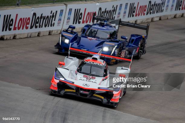 The Acura DPi of Dane Cameron and Juan Pablo Montoya, of Colombia, , races on the track during the IMSA WeatherTech Series race at the Chevrolet...