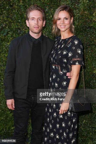 Glenn Howerton and Jill Latiano attend the CHANEL Dinner Celebrating Our Majestic Oceans, A Benefit For NRDC on June 2, 2018 in Malibu, California.