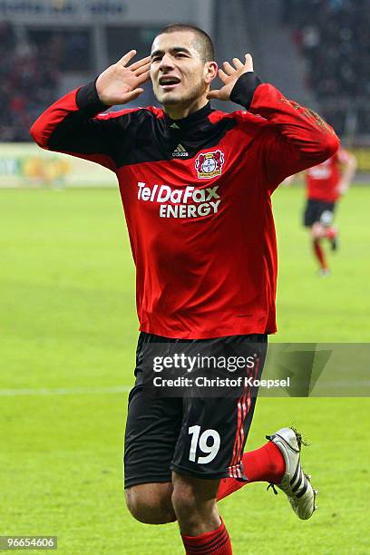 Eren Derdiyok celebrates his team's second goal during the Bundesliga match between Bayer Leverkusen and VfL Wolfsburg at the BayArena on February...