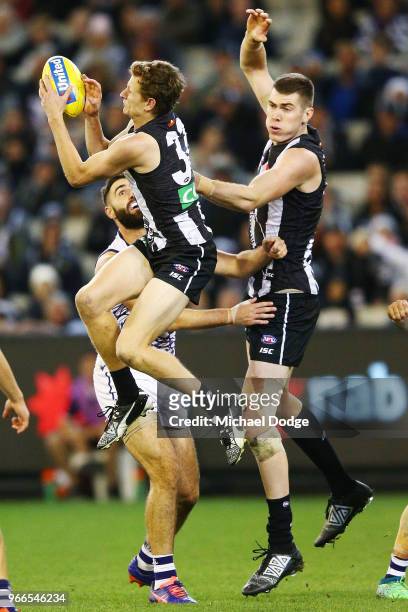 Will Hoskin-Elliott of the Magpies marks the ball during the round 11 AFL match between the Collingwood Magpies and the Fremantle Dockers at...