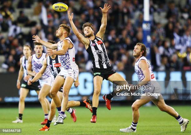 Tom Phillips of the Magpies and Tom Sheridan of the Dockers compete for the ball during the round 11 AFL match between the Collingwood Magpies and...