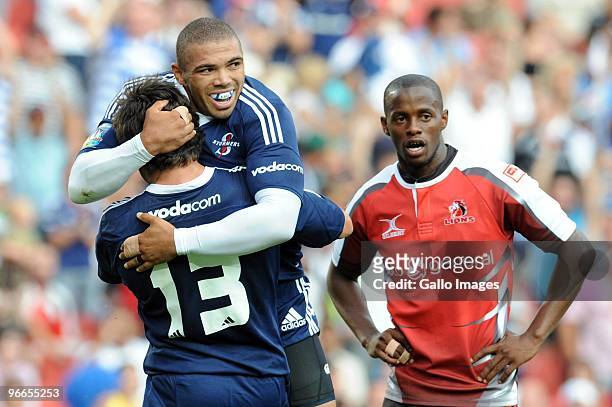 Bryan Habana and Jaque Fourie of Stormers celebrates a try while Wandile Mjekevu of Lions looks on during the Super 14 match between Auto and General...